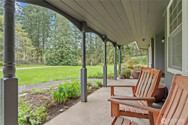 Covered front porch is perfect to catch the sunrise