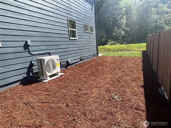 Spacious side yard perfect for dog run, raised bed garden, shed space, or bbq!