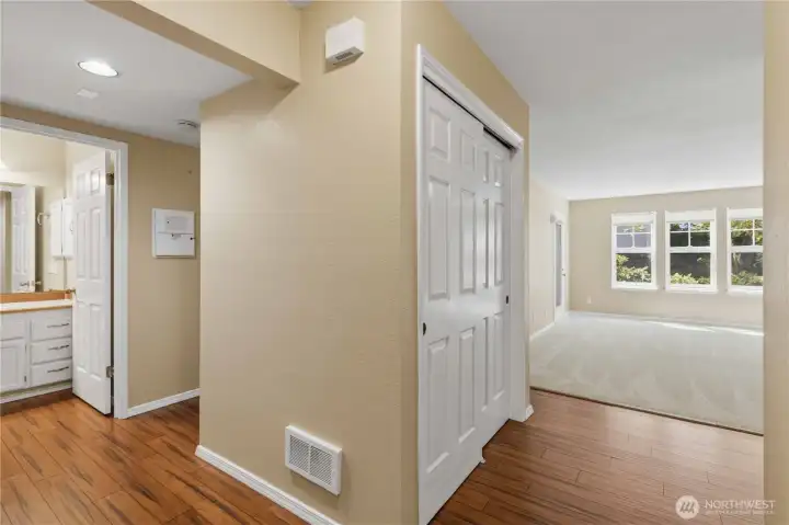 Closet near living room and kitchen.