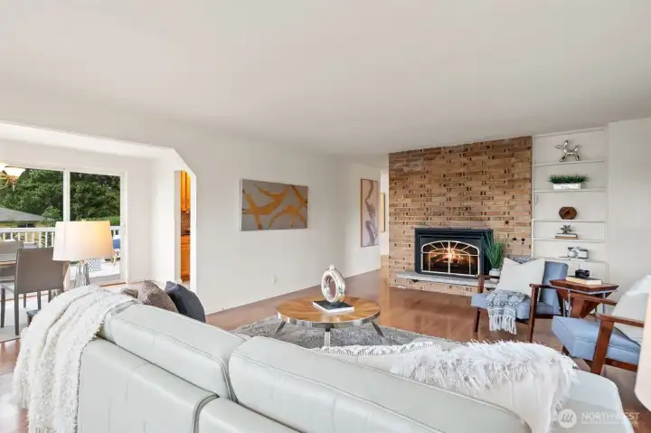 Living room with views toward dining room & entertainment sized view deck Living room with views toward dining room & entertainment sized view deck