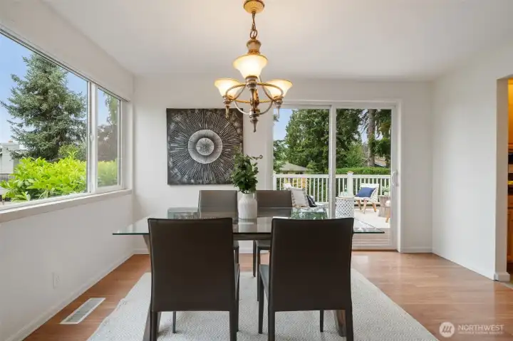 Dining room off kitchen and view deck - with stairs to back yard Dining room off kitchen and view deck - with stairs to back yard