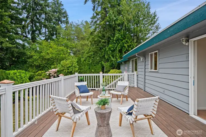 Large entertainment sized deck with sound and mountain views - steps down to yard and creek Large entertainment sized deck with sound and mountain views - steps down to yard and creek