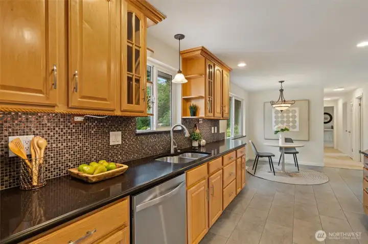 Kitchen features wood cabinets galore, stainless appliances and granite style countertops Kitchen features wood cabinets galore, stainless appliances and granite style countertops