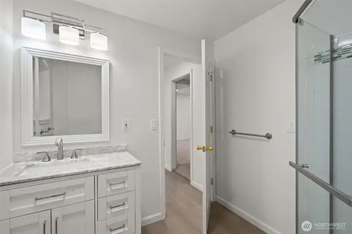 Lower 'level in' bathroom - serves office, family room and laundry room - easy access from backyard. Lower 'level in' bathroom - serves office, family room and laundry room - easy access from backyard.