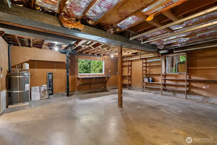 Large deep 2 car garage with workbench and storage shelves. Large deep 2 car garage with workbench and storage shelves.