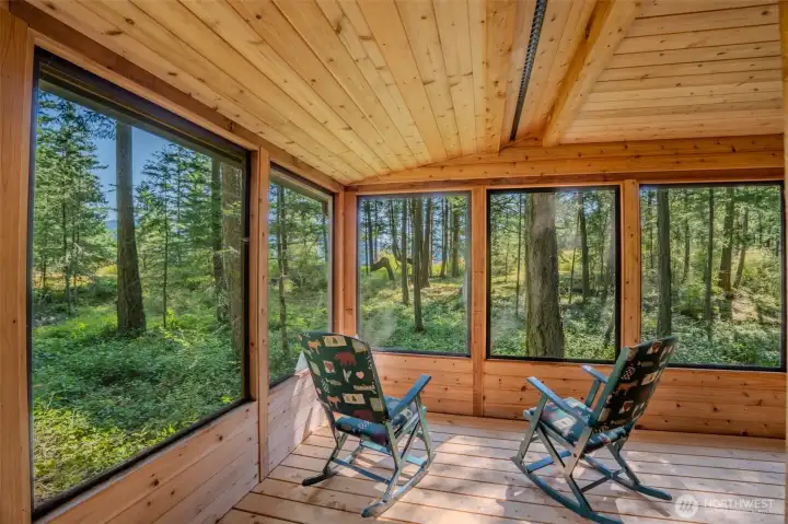 Screened deck provides protection from the elements.