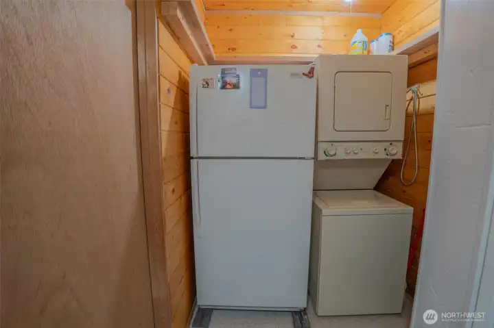 Fridge and laundry in the utility room.