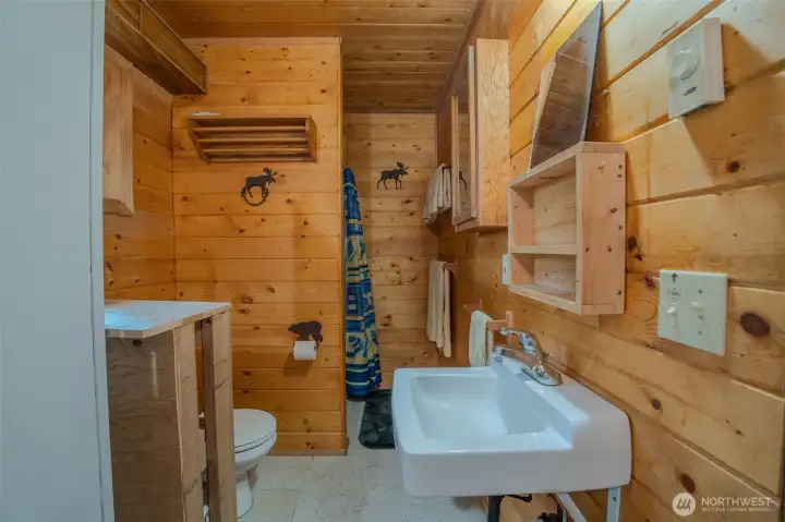 Bathroom/utility room with 3/4 shower