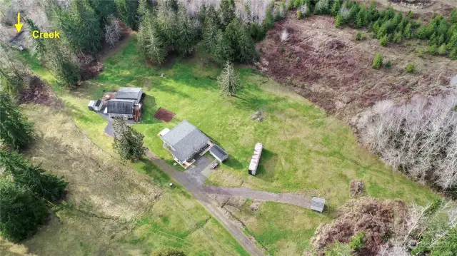 Drone shot of the overview of the property, over 5 acres, lots of room to run and play!