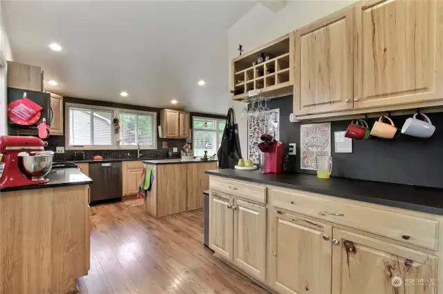 View of the main house kitchen from the back patio doors, look at all the storage and counter space.