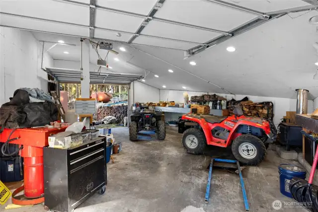 Garage with snowmobile lift and winch.