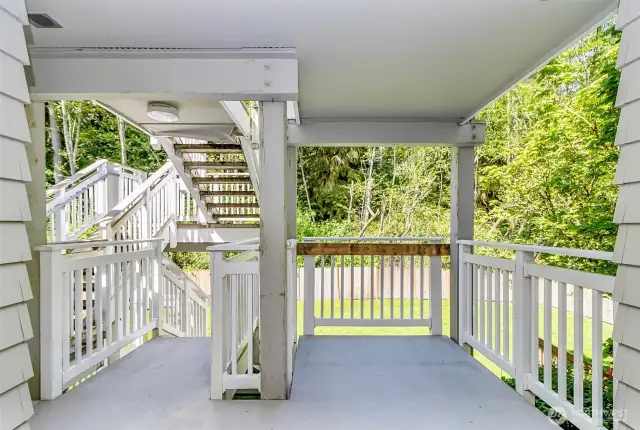 Back deck off the with scenic view of greenbelt and stairs to back yard