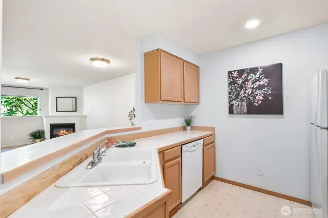 Kitchen with eating bar open to the living/great room