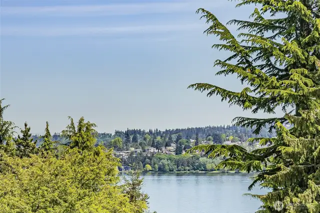 Seattle home southwest of Lake Washington sees sail boats wafting by.
