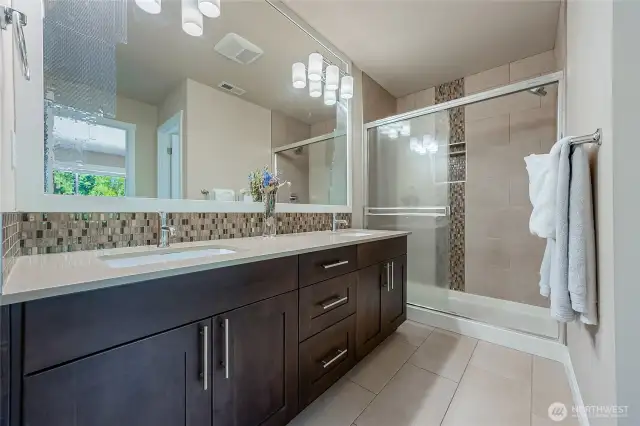 Master bath shower with ceiling to floor tiles. Gas tankless water heater provides instant, steamy hot shower!