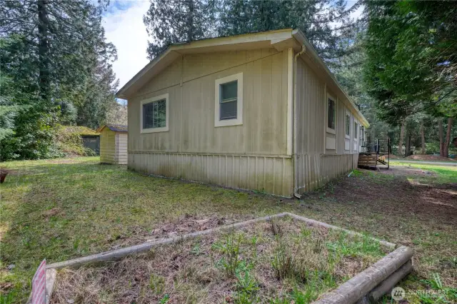 Rear yard with room for garden beds