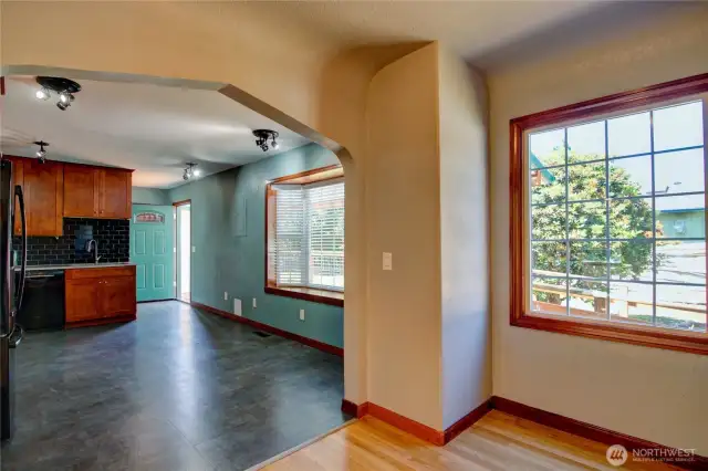Looking into the kitchen from dining room.   The kitchen has room to put another table for eating if needed.