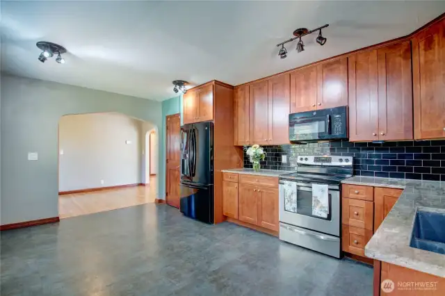 Beautiful granite counter tops.  Plenty of storage.  Pantry to the left of the fridge.