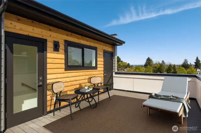 Private patio space with contemporary exterior finishes and room to relax or garden.
