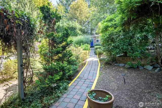 Backyard Has Stone and Rock Pathways.