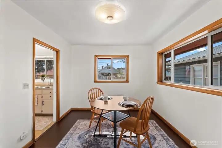This charming dining area is perfect for intimate dinners, offering a cozy space that flows effortlessly into the main living area.
