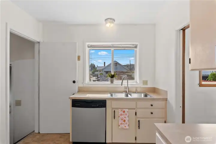 Large window over sink provides natural light