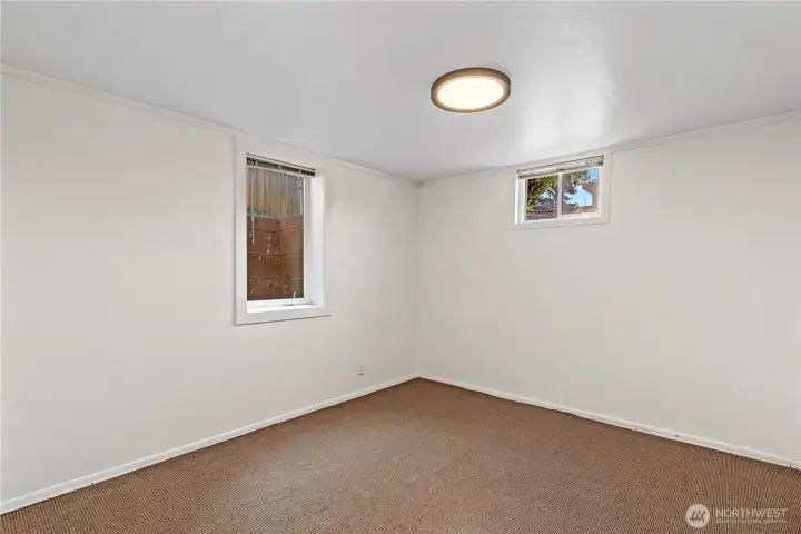 Bedroom 3 has two windows that provide natural light. A great space for guests, a home office, or additional storage