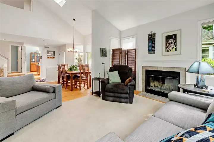 Wood burning fireplace. Dining area with sunny skylight.