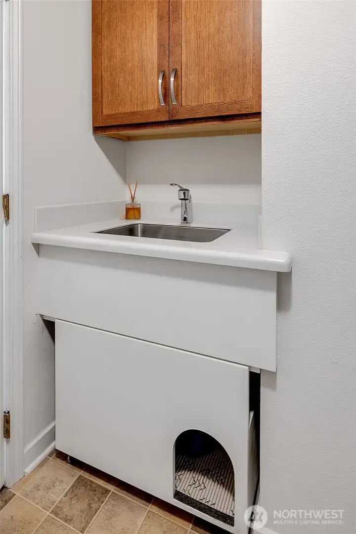 Utility sink... with a built-in home for your non-human friends.