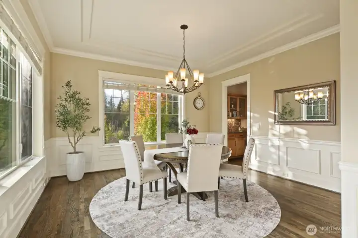 Entertainer's will revel in the numerous living spaces ready to host in - iconic dinner parties await in this spacious dining room!