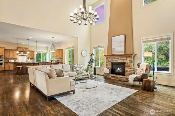 Flow effortlessly from the kitchen into this incredible open concept family room, complete with a two-story centerpiece gas fireplace.