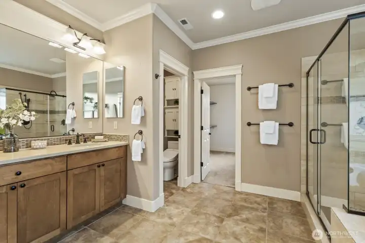 Dual vanities, a huge dual-head shower, and soaking tub - plus a fantastic walk-in closet.