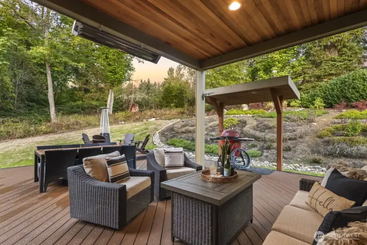 The low-maintenance composite decking stands up to our rainy PNW winters, and the heaters keep the covered space toasty warm so you can enjoy this space year-round.