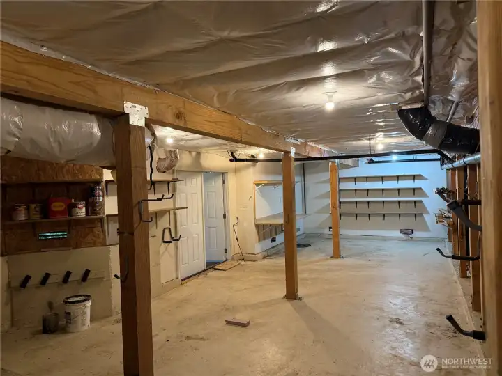 Second view of additional space accessed via double doors on patio level.