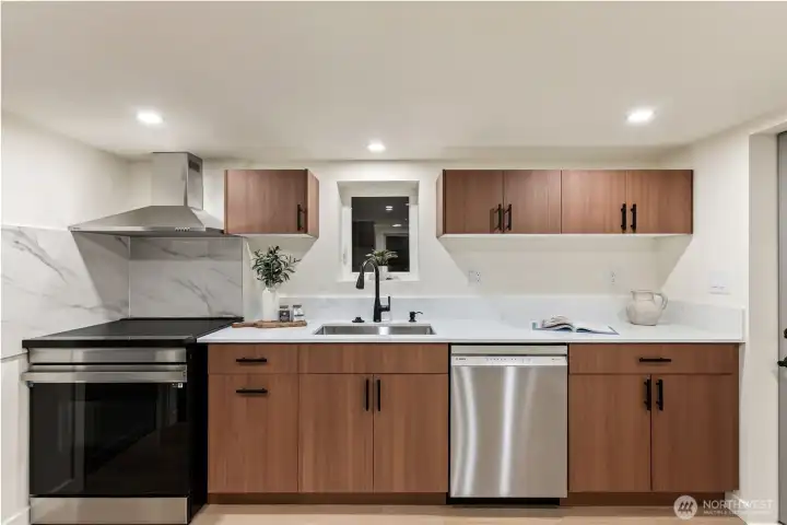 Full size kitchen in basement area.