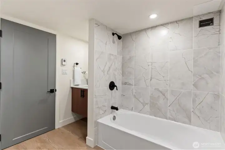 Full bathroom in basement area.