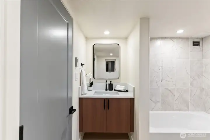 Full bathroom in basement area.