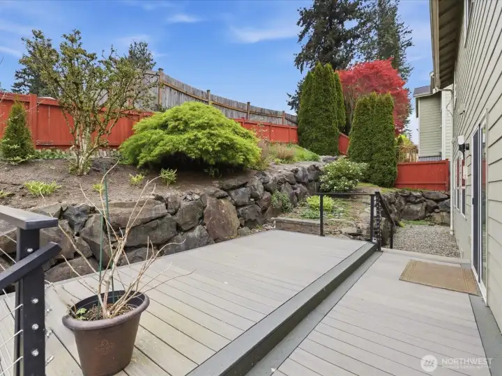 Trex deck overlooking the landscaped backyard—ideal for relaxing or entertaining.