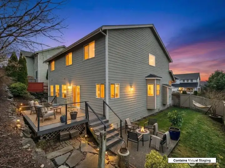 Evening view highlighting the home’s warm and inviting exterior.