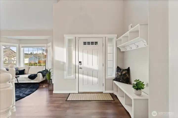 The entry offers an easy, mudroom-like feel with functional space for shoes, coats, and everyday essentials.