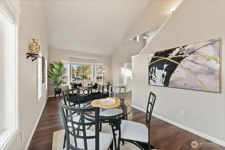 The dining room is perfectly positioned off the living space, offering an ideal setting for gatherings and everyday meals.