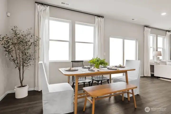 Dining space can accommodate a large table to host dinner parties. Actual home is under construction. Colors, materials, and features may vary. See site agent for details.