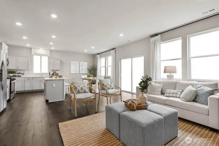 Very open concept with lots of windows for natural light into the heart of the home. Actual home is under construction. Colors, materials, and features may vary. See site agent for details.