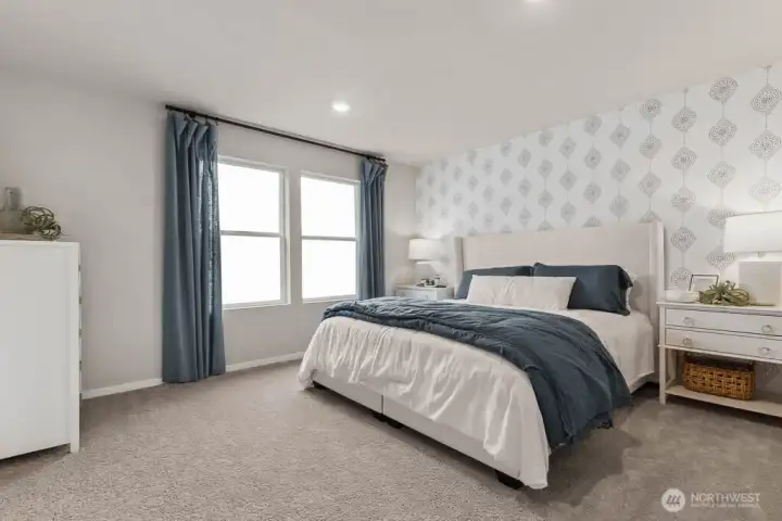 Large primary bedroom can accommodate a King size mattress, large nightstands, and more! Actual home is under construction. Colors, materials, and features may vary. See site agent for details.