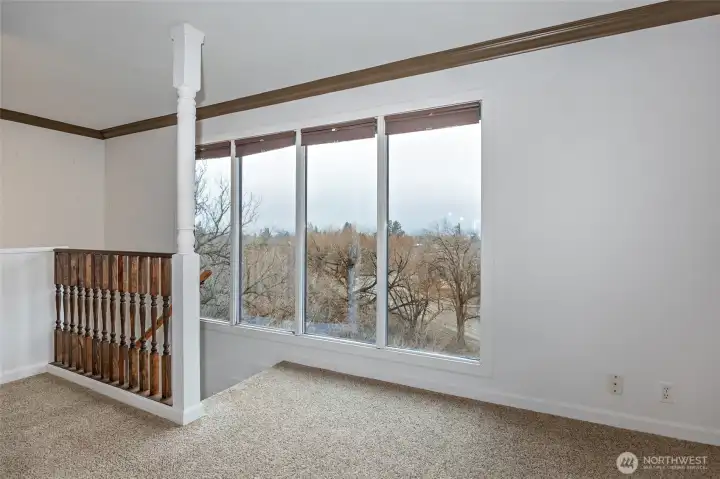 Stairway with large picture windows