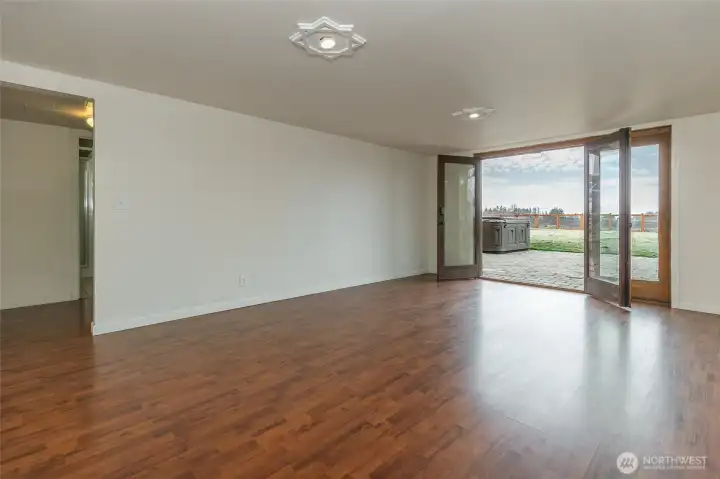 French doors that lead out onto patio with hot tub