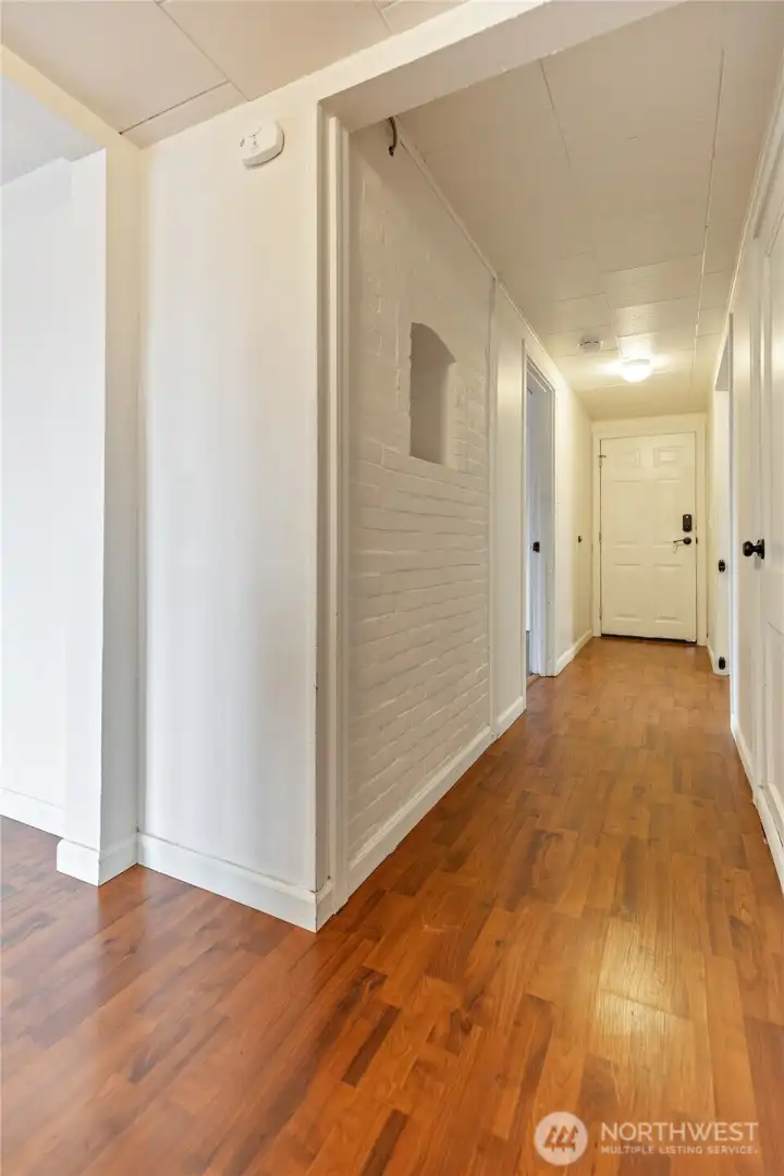 Hallway in lower level leading to garage