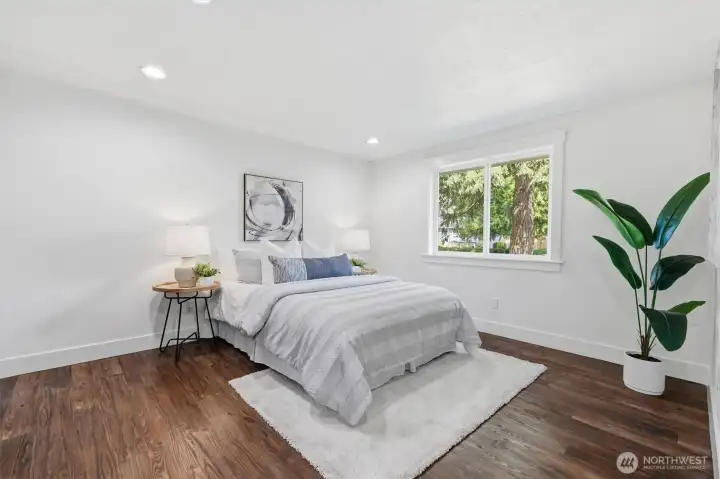 Primary bedroom + ensuite bathroom (staged)