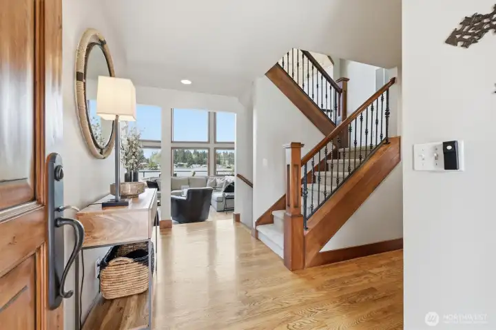 Entryway welcomes you with a view!  Interior doors are solid wood from Mexico.  Hardwood floors throughout most of main floor.