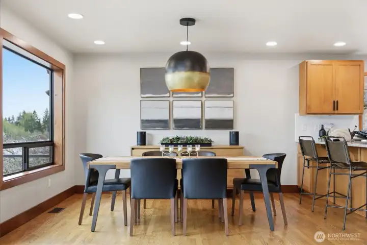 Plenty of room for your dining table between the kitchen and living room.